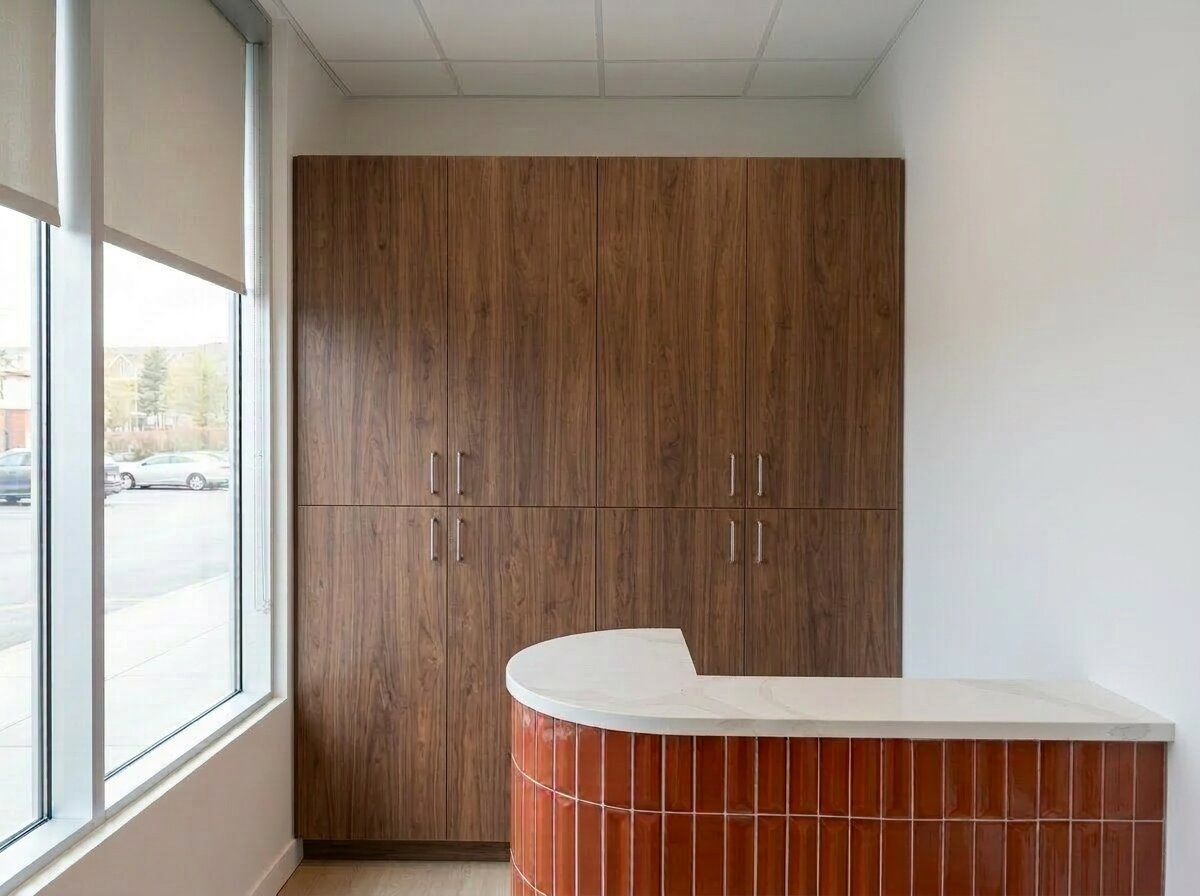 Floor-to-ceiling walnut wood-grain lockers in a premium office reception